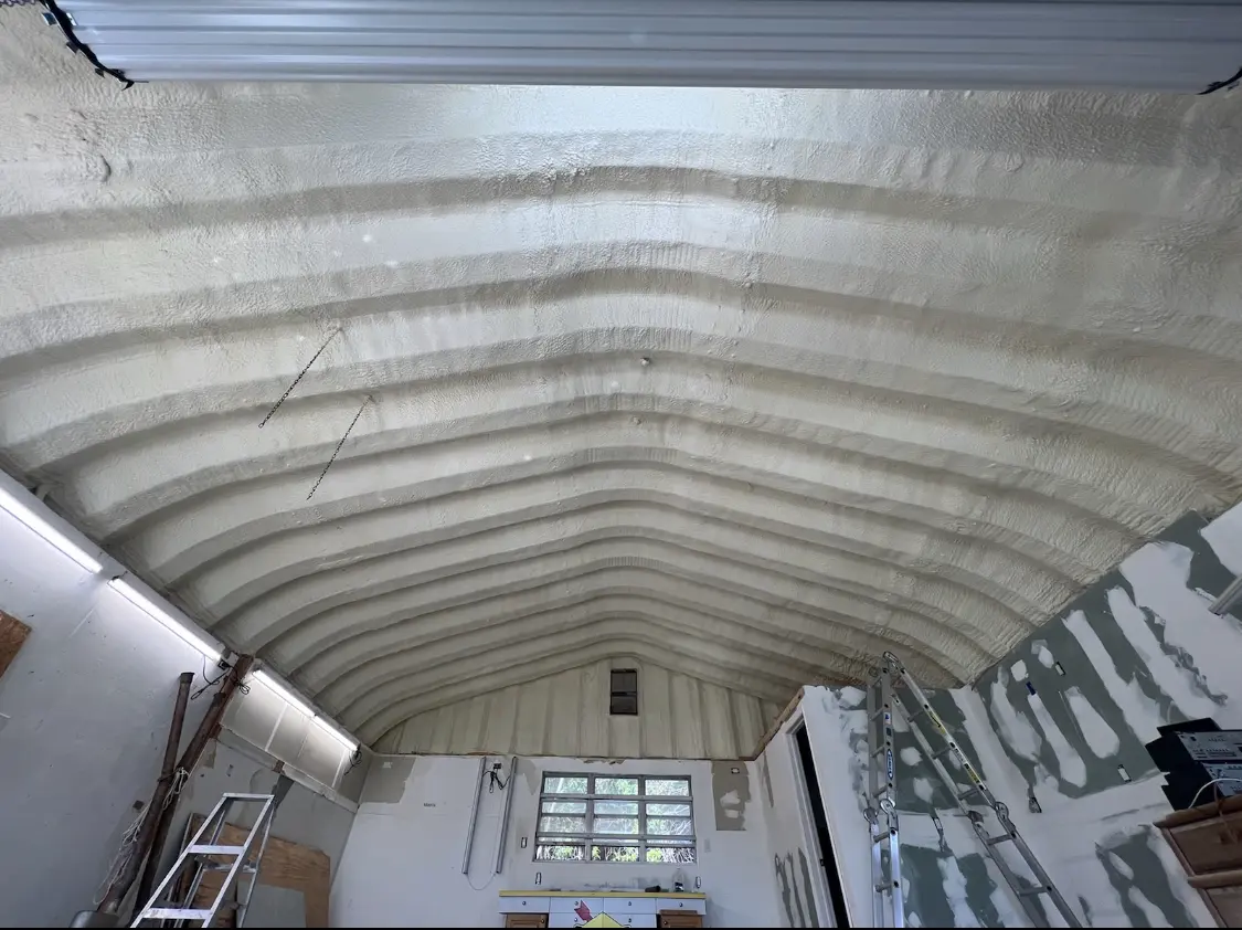 Spray polyurethane foam applied to the underside of a metal roof deck in Pittsburgh
